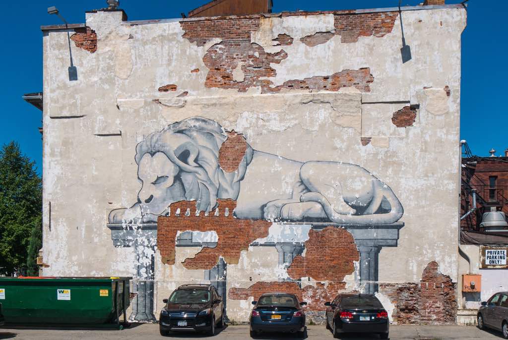 Decrepit lion mural at corner of Delaware Ave and Virginia St in Buffalo NY